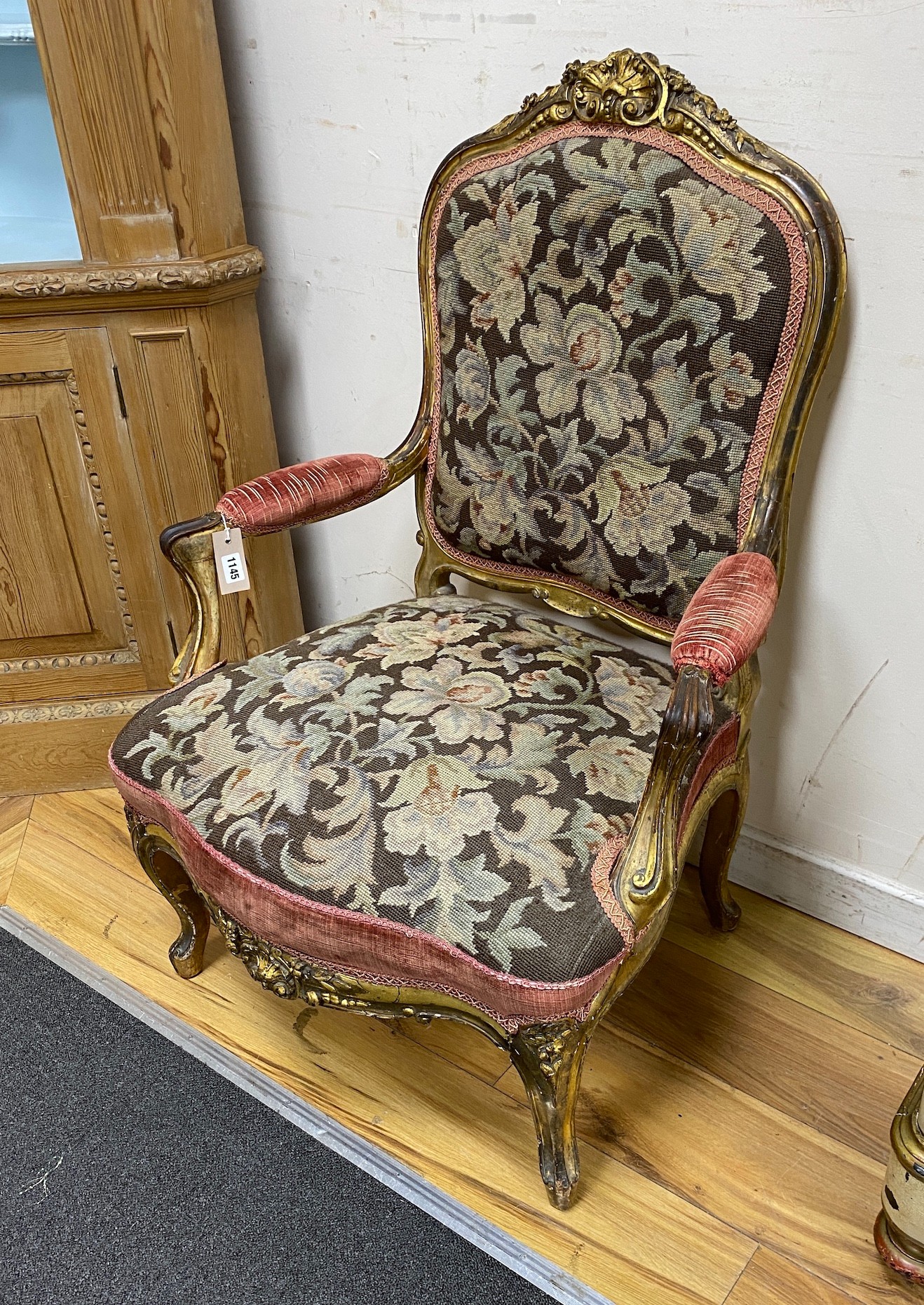 A 19th century French carved giltwood open armchair with floral tapestry upholstery, width 65cm, depth 66cm, height 96cm